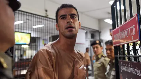 AFP Hakeem al-Araibi being escorted to a courtroom in Bangkok (file photo 4 February)