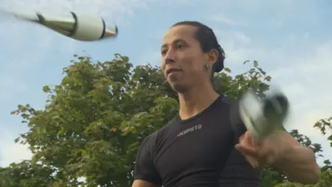 BBC A juggler juggling