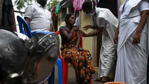 Getty Images A door-to-door campaign in Tamil Nadu state