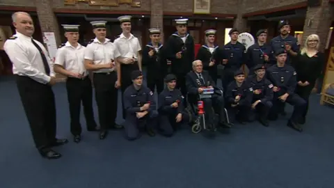 Bernie Beckett with current navy servicemen