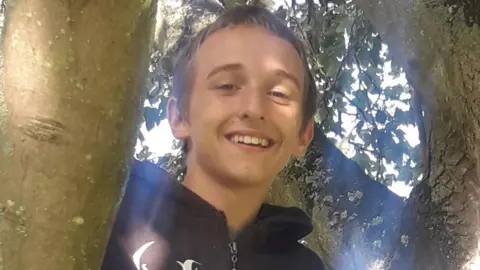 Family Photo Alfie in a tree