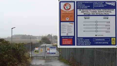 Rail Accident Investigation Branch A view of the access point staff used to reverse on to the tracks near to Millbrook, Bedfordshire. It is a cloudy, wet day. 
