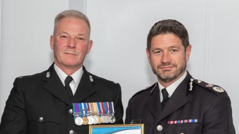 Zach Printer, left, with his commendation and acting Chief Constable Jim Colwell