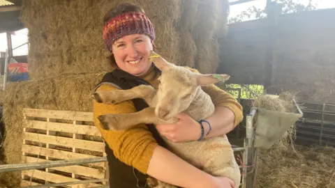 Kate Esler with one of her sheep in Kingston Seymour