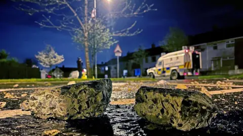 Liam McBurney/PA Wire Pieces of masonry that were thrown at police officers in Carrickfergus on Sunday