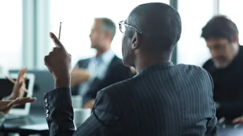 Getty Images Business boardroom with diverse range of people