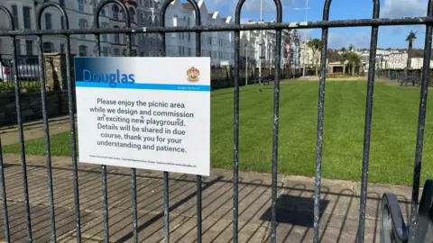 Sign at former play area in sunken gardens on Douglas Promenade