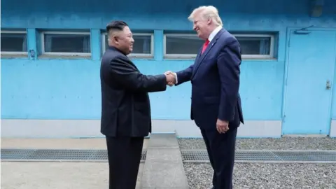 Reuters US President Donald Trump shakes hands with North Korean leader Kim Jong Un as they meet at the demilitarized zone separating the two Koreas, in Panmunjom, South Korea, 30 June 2019.