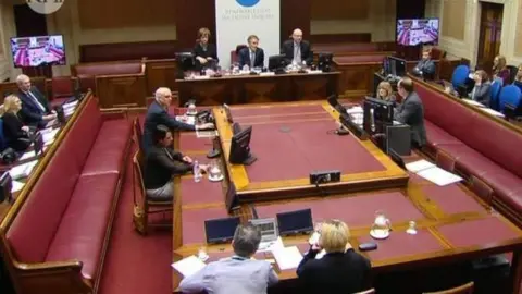 RHI Inquiry A sitting of the RHI Inquiry, which raised questions about about the system of government in Northern Ireland