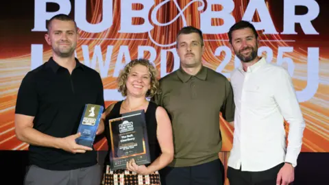 National Pub and Bar Awards The pub's team, including Murray Ward [second from the right], collecting the award on Tuesday.