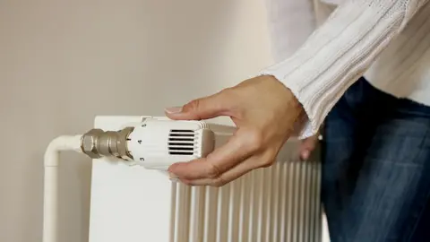 Getty Images person turns radiator