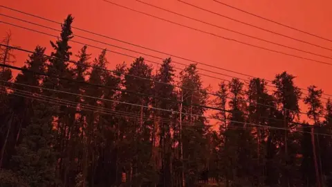 Courtesy Michel Labine Photo of a red sky outside Michel Labine's home in the Northwest Territories