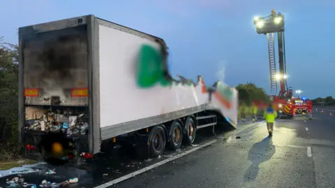 National Highways Firefighters attending lorry fire