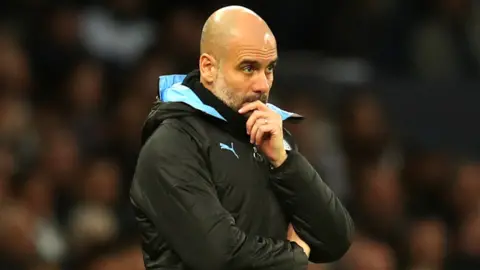 Manchester City boss Pep Guardiola looks pensive during Premier League defeat to Tottenham