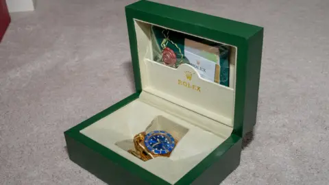 Northamptonshire Police A Rolex watch in a green box