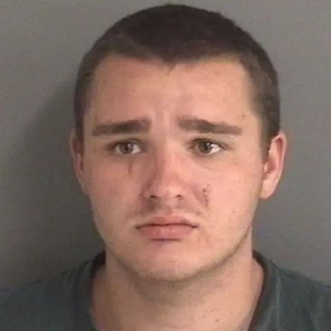 Police handout Collin Daniel Richards was found with scratches on his face, police say