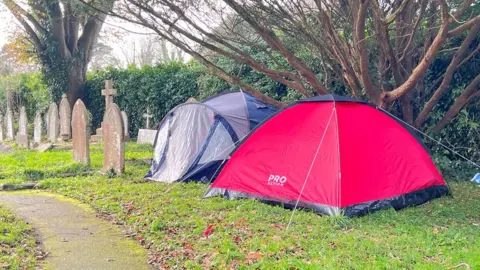 Tents in graveyard