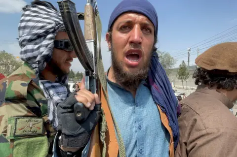 Reuters Taliban forces patrol near the entrance gate of Hamid Karzai International Airport, a day after U.S troops withdrawal, in Kabul, Afghanistan August 31, 2021.