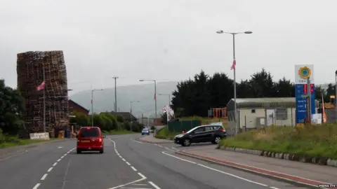 Press Eye Filling station with bonfire in background