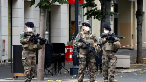 Reuters Special forces stand guard near the scene of the attack