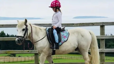 Kimberley Roberts Ivy Roberts riding a pony