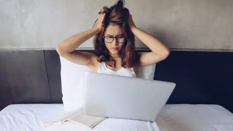 Getty Images Woman looking for a job online