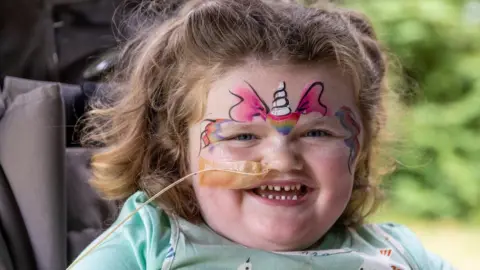  Jon Bolton Ellie in face paint enjoying face the Julia's House Family Garden Party