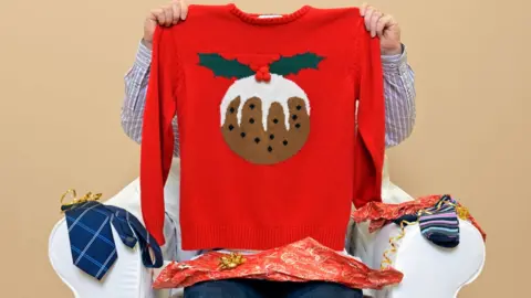 Getty Images Christmas jumper with a Christmas pudding