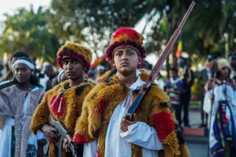 AFP Youth pose during the commemoration of the 126th victory of Adwa, at Menelik square in Addis Ababa, Ethiopia, on March 02, 2022. - The Battle of Adwa was the climactic battle of the First Italo-Ethiopian War. The Ethiopian forces defeated the Italian invading force on March 1, 1896, near the town of Adwa. The decisive victory thwarted the campaign of the Kingdom of Italy to expand its colonial empire in the Horn of Africa.