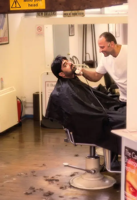 Martin Bond A person getting a haircut