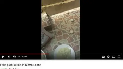 YouTube Photo of balls of rice on the ground next to a plate of cooked rice