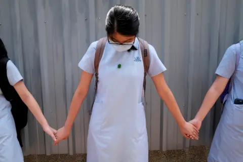 Reuters File photo of students forming a human chain in protests in June