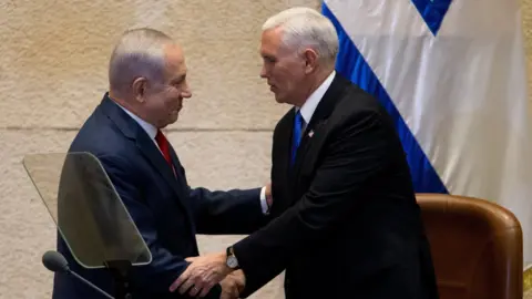 EPA Israeli Prime Minister Benjamin Netanyahu shakes hands with US Vice-President Mike Pence in Jerusalem (22 January 2018)