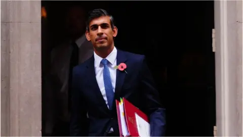 PA Media Rishi Sunak on his way to PMQs