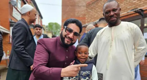 Aisha Iqbal/BBC Abid Hussain poses for a photo