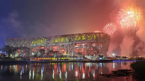 Getty Images Fireworks explode over the National Stadium, also known as the "Bird's Nest",