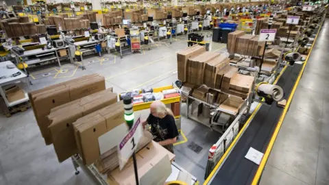 AFP/Getty Employees of American electronic commerce company Amazon prepare items for dispatch in Bad Hersfeld, central Germany on December 7, 2017.