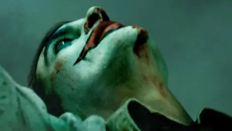 Warner Bros/DC Comics Joaquin Phoenix as The Joker