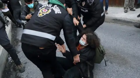 Reuters A woman scuffles with officers at Bogazici University, 1 February