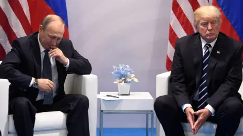 Getty Images US President Donald Trump and Russia's President Vladimir Putin shake hands during a meeting on the sidelines of the G20 Summit in Hamburg, Germany, on July 7, 2017.