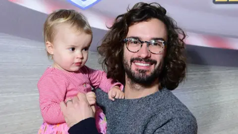 PA Media Joe Wicks and daughter Indie