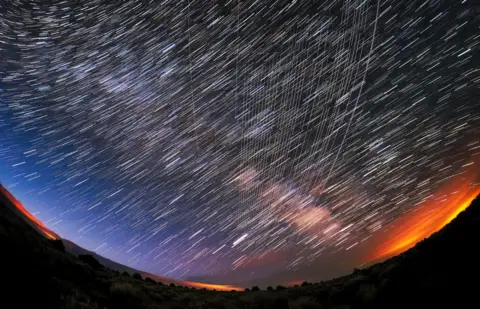 Mike Lewinski/CC Starlink Satellites pass overhead near Carson National Forest, New Mexico, photographed soon after launch