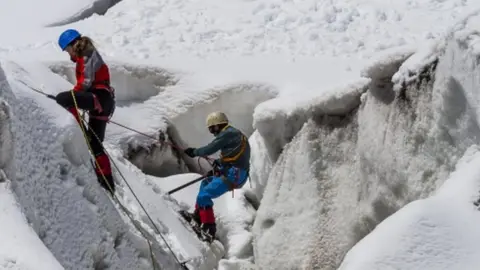 Getty Images Mountaineers climbing the Alps