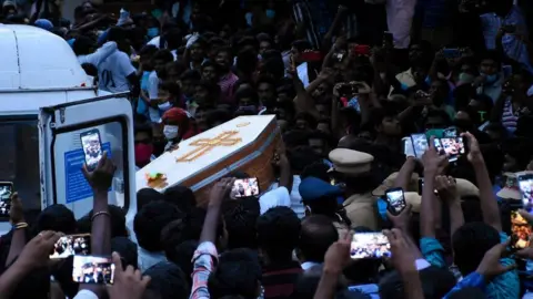 Getty Images Residents gather as they carry the coffin of Jeyaraj, 58, and son Fenix Immanuel, 31, allegedly tortured at the hands of police in Sathankulam, Thoothukudi district in the Indian state of Tamil Nadu.