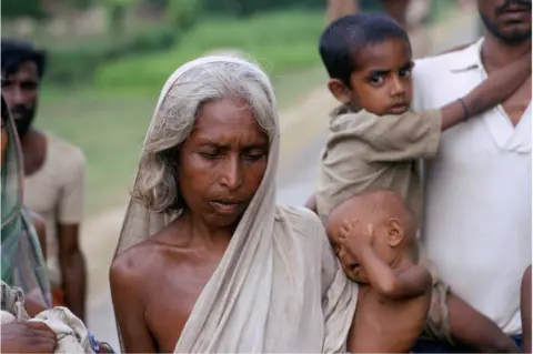 Getty Images Woman and children at a refugee camp filled with East Pakistani refugees on the outskirts of Calcutta in India in 1971