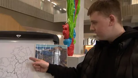 A student points at a map of Ireland