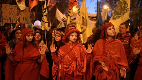 Getty Images Climate change activists march in silence in the 'Fridays For Future' climate change mass protest