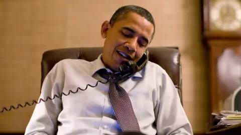 Getty Images Barack Obama on the phone in the White House