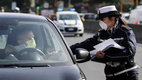 EPA Police officer checking documents of a driver in a car