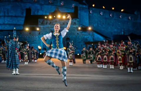 Jane Barlow/PA Media Highland dancers perform on the Esplanade of Edinburgh Castle at this year's Royal Edinburgh Military Tattoo, 4 August 2022.